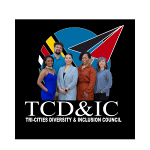 Backdrop is black with the colorful logo atop it. The board members stand in front of it and TCD&IC Tricities Diversity & inclusion council is below